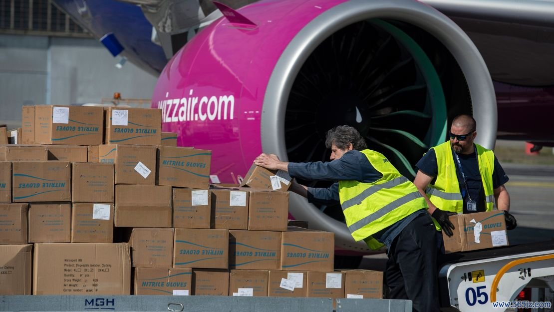 Workers unload boxes of PPE from an airplane arriving in Budapest, Hungary from China, back in April 2020.