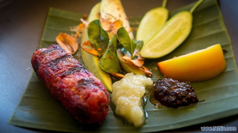 Colours of the Garden at Soneva Kiri, Thailand: The menu consists of seven plant-based dishes that celebrate organic fruit, vegetables and herbs. Pictured here is a deconstructed dish comprised of betroot jerky, sticky rice, sour mango and crispy garlic. 