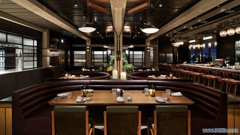 HENRY, Hong Kong: The interior features leather banquettes and polished brass along with a marble bar that leads to a terrace for cocktails, fine wines or cigars.